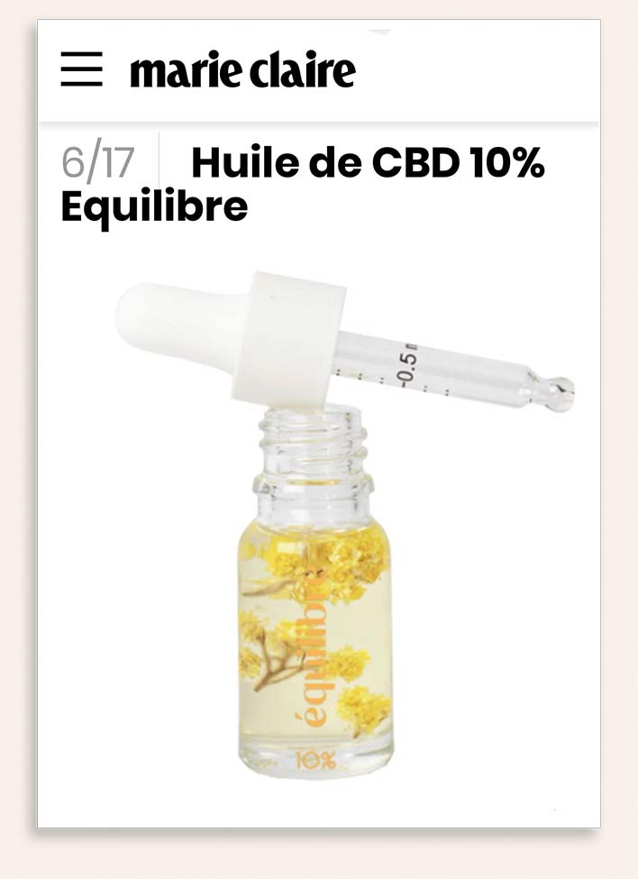 Flacon avec pipette gradué d'huile de CBD Equilibre 10% et fleurs immortelles dans l'article de presse de Marie Claire